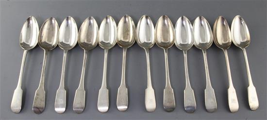 A set of twelve George V silver fiddle pattern table spoons, C.W Fletcher & Sons Ltd, 25 oz.